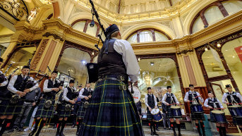 Brave hearts: a flash mob of the Scotch College Pipes and Drums Band launches the inaugural Melbourne Tartan Festival at Block Arcade.