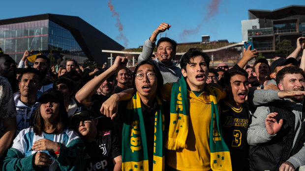 Australian and Argentinian supporters in Sydney’s Darling Harbour watch the knockout match between the Socceroos and Lionel Messi’s eventual winners in Qatar last year.
