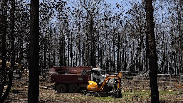 Heavy machinery and a truck on a cleared site where was a home destroyed on November 8, 2019.