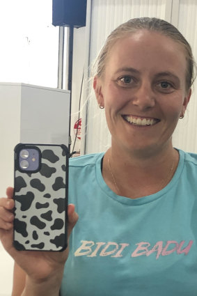 Zoe Hives with her cow-themed phone cover.