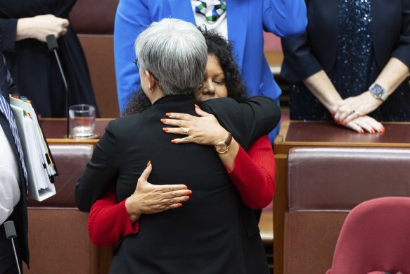 Penny Wong, Labor’s leader in the Senate, and Indigenous Australians Assistant Minister Malarndirri McCarthy embrace on Monday.