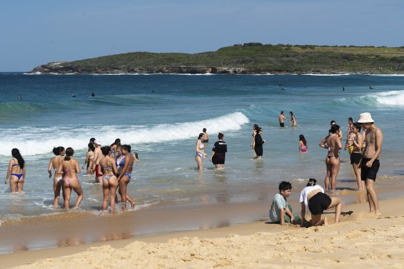 Beachgoers at Maroubra beach where temperatures reached 34 degrees today.