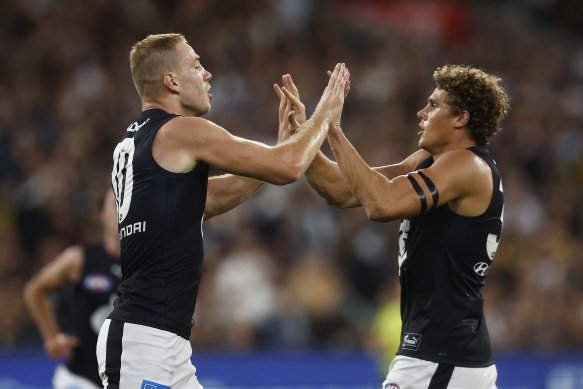 Harry McKay and Charlie Curnow celebrate a goal.