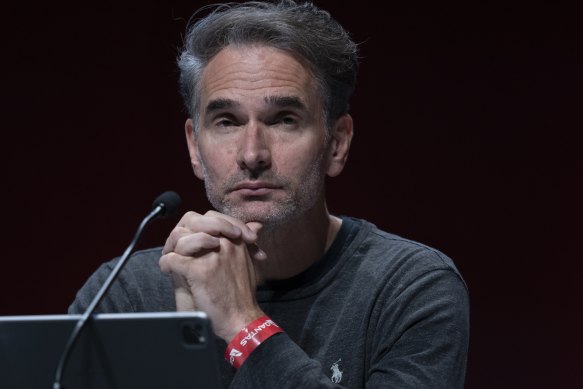 Ad guru Todd Sampson scraped through with his re-election to the Qantas board despite a strong protest vote. 