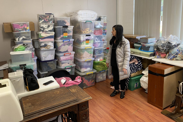 Elena Mazziotta with the fraction of costumes and materials salvaged from her workshop.