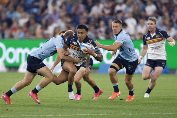 Len Ikitau is takcled for the Brumbies