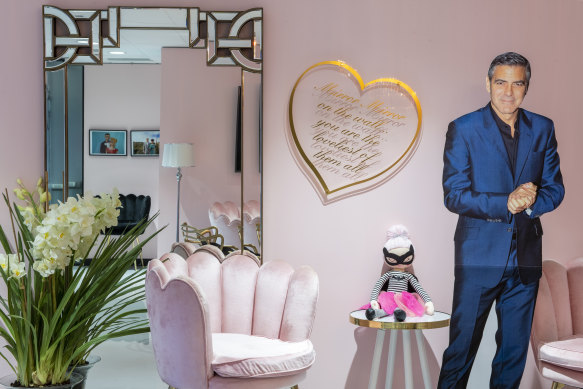 Burmeister’s Melbourne clinic, known as the "pink palace", features George Clooney in life-size cardboard.  