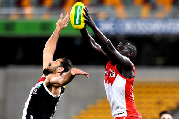 Sydney's Aliir Aliir and Paddy Ryder of the Saints battle for the ball.