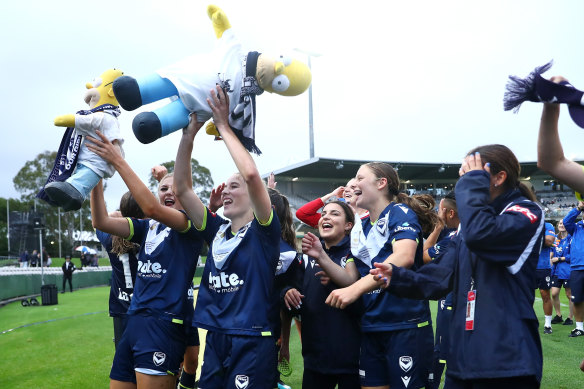 Melbourne Victory players celebrate after their A-League Women’s grand final triumph.