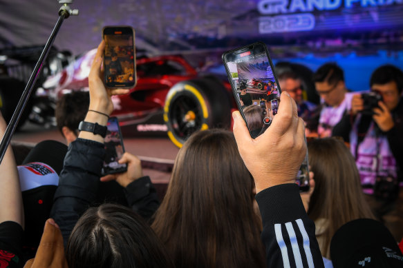 Crowds flock to get a photo of the Formula One drivers on Thursday.