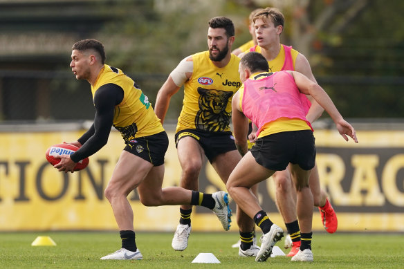 Dion Prestia runs with the ball during an AFL Richmond Tigers training session at Punt Road Oval, in Melbourne, on Thursday.
