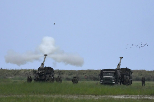 Philippine troops fire shots during the Balikatan military exercises on Wednesday.
