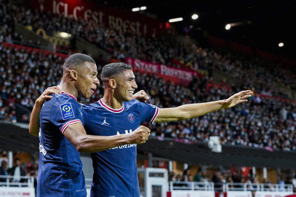 Kylian Mbappe and Achraf Hakimi celebrate a goal from the latter for PSG.