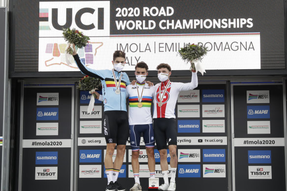 Julian Alaphilippe, centre, on the podium with silver medallist Wout van Aert, left, and bronze medallist Marc Hirschi, right. 