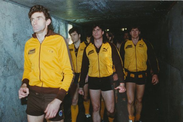 Hawthorn captain Michael Tuck leads the Hawks out for the 1991 grand final.