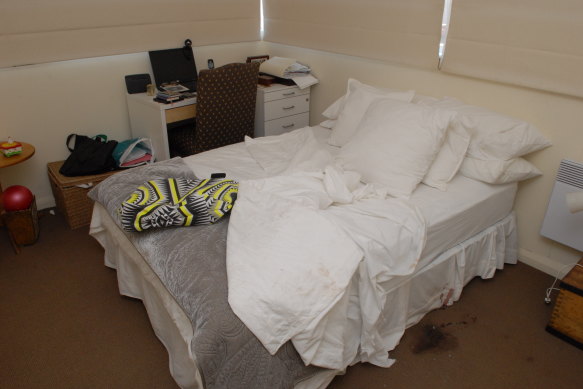 Photos of a bedroom at the woman’s Middle Park apartment  where blood was found on the ground. 