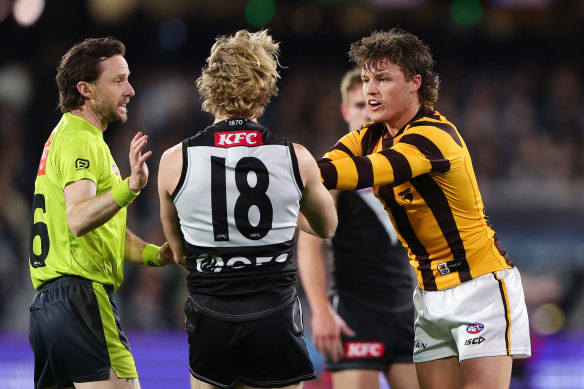 Hawthorn’s Jack Ginnivan and Port’s Jason Horne-Francis exchange pleasantries on Friday night.