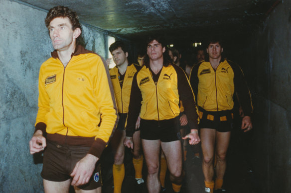 Hawthorn captain Michael Tuck leads the Hawks out for the 1991 grand final.