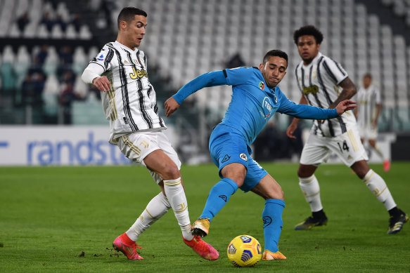 Leo Sena, on duty for Spezia in 2021, gets his studs in on Cristiano Ronaldo.