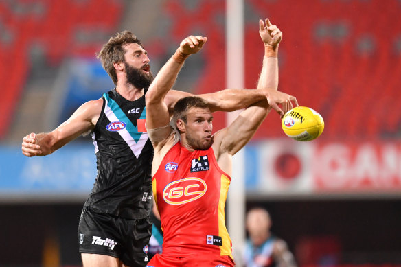 Port's Justin Westhoff battles the Suns' Sam Day for the ball.