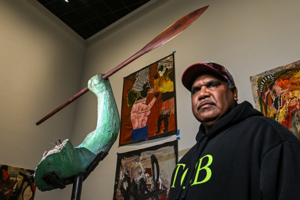 Jimmy Frank Jupurrula with a spear incorporated into the fist of an Incredible Hulk sculpture.