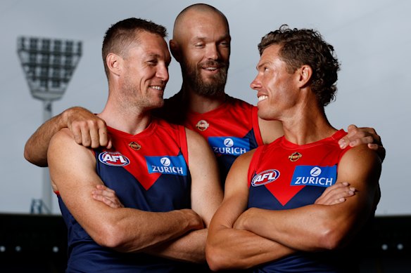 Melksham (right) with Tom McDonald (left) and Max Gawn (centre), who reached their own 250-game milestones in the same match recently.