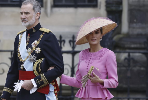 Well, at any rate it kept out the rain. Spain’s King Felipe and Queen Letizia attend the coronation.