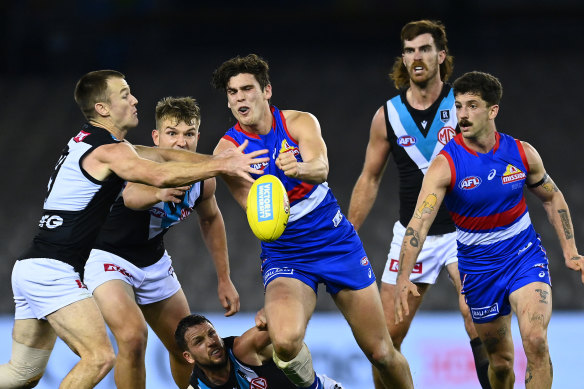 Lewis Young of the Bulldogs handballs during the Bulldogs’ loss to Port Adelaide on Friday night.