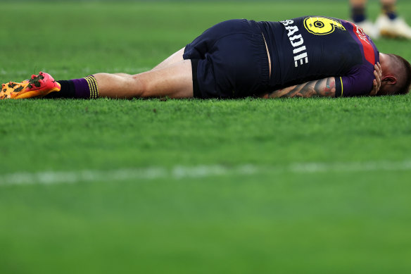 Cameron Munster lies on the ground injured during Magic Round.