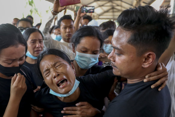 Mourners weeping at a funeral for a protester in Mandalay in February, 2021. Witnesses said the military shot at mourners at a funeral in Yangon on Sunday. 