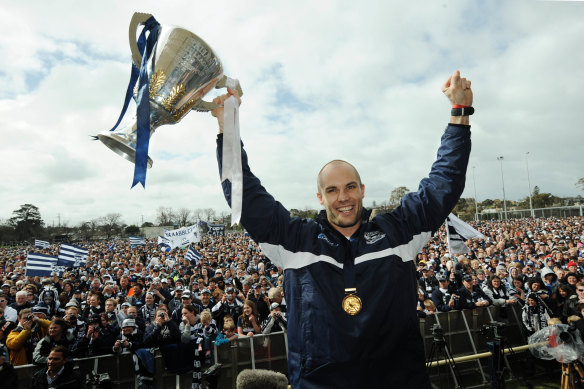 Sydney CEO Tom Harley held up two premiership cups as Geelong captain