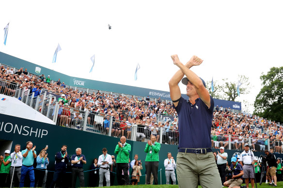 Billy Horschel makes the West Ham United “Irons” sign after winning the BMW PGA Championship in England.