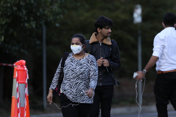 Workers leave Newmarch House late on Tuesday after revelations three more staff members have tested positive. 