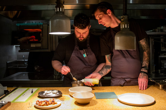 Head chef Ryan Perry (left) and executive chef Jarrod Walsh team up in the kitchen. 