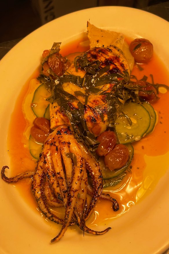 Grilled Squid with pickled cucumber, roasted red grapes and vine leaves.
