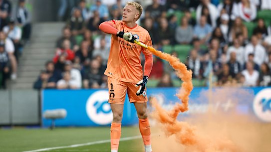 Tom Glover had earlier picked up a flare to remove it from the pitch.