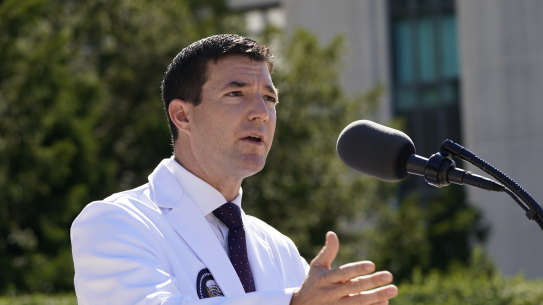 Dr. Sean Conley, physician to President Donald Trump, briefs reporters at Walter Reed hospital. 