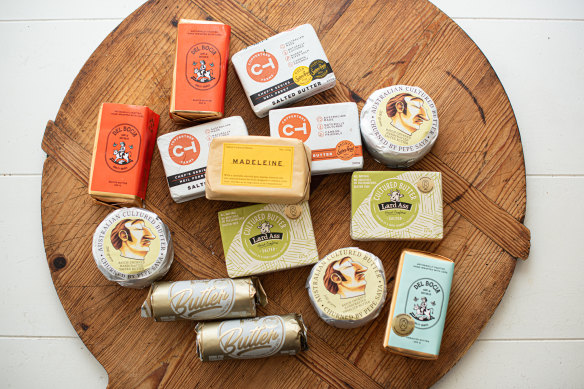 Artisan butters (clockwise from top left) Del Bocia salted butter, CopperTree Salted, Pepe Saya, Lard Ass, Del Bocia unsalted, Gippsland Jersey and (centre) Madeleine.
