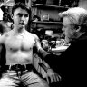 Tony Cohen from The Illustrated Man Tattoo Studio gives 18-year-old Michael Nagle a tattoo.