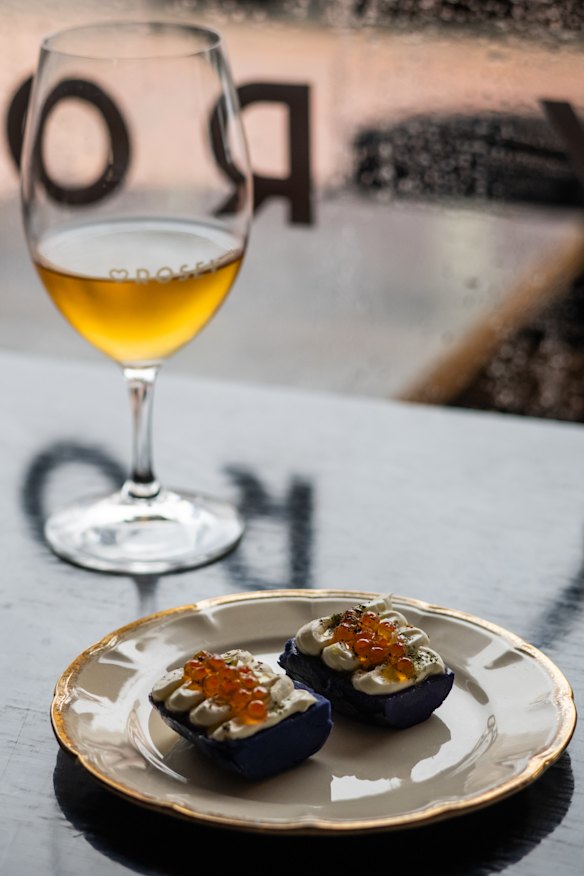 Salt-baked midnight pearl potatoes with quark, lovage and roe at Hey Rosey.