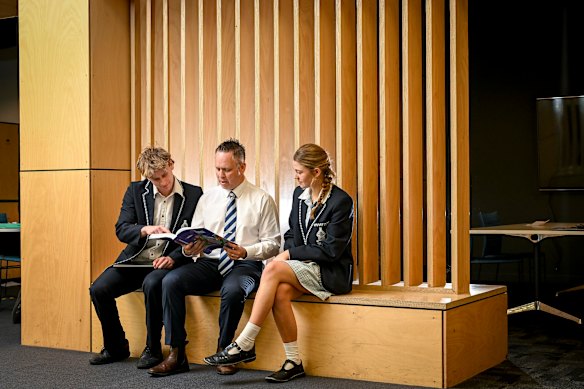 Business management has become one of the most popular subjects for VCE at Tintern Grammar School. Teacher James Henderson and year 12 students Matilda Bailye and Tom Hutcheon.