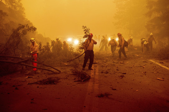 Firefighters battling the Dixie Fire in Plumas County, California.
