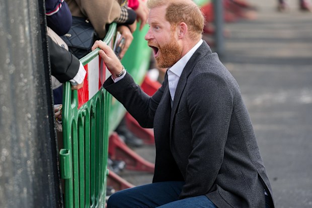  Prince Harry, Duke of Sussex greets well-wishers when he arrives at the Community Recording Studio (CRS)