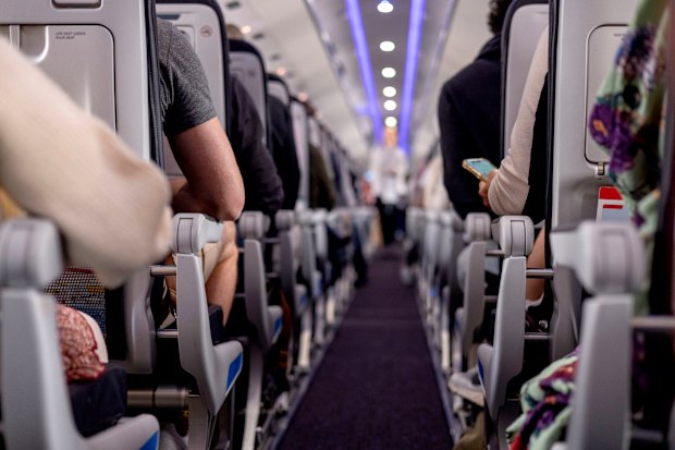 If you’re willing to sit apart from your travel companions, you can increase your chances of getting an empty seat next to you.