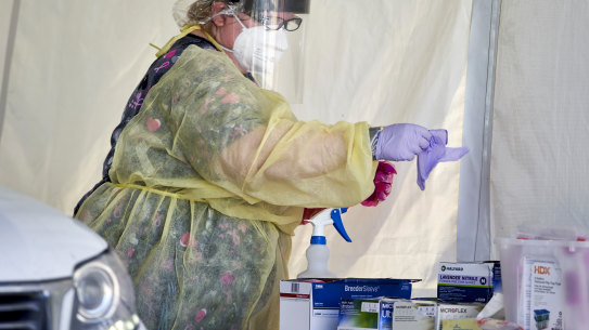 A nurse prepares to administer a coronavirus test in Nebraska this week.