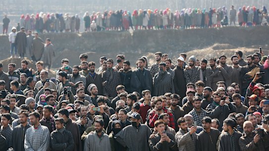 Kashmiri villagers gather to look at the wreckage of an Indian aircraft after it crashed in Budgam area on Wednesday.