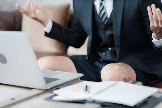 Stock image of a man working in shorts