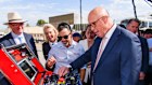 Peter Dutton tries out a piece of machinery at Wallis Drilling in the WA electorate of Hasluck.