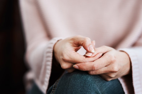 Cropped shot of a woman sitting on a sofa and feeling anxious Credit: iStock