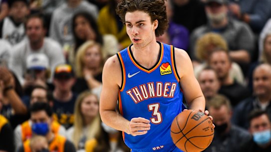 Josh Giddey handles the ball in his NBA debut.